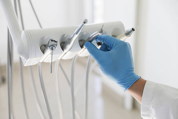 Professional Tooth Extraction technician working in Henderson, LA